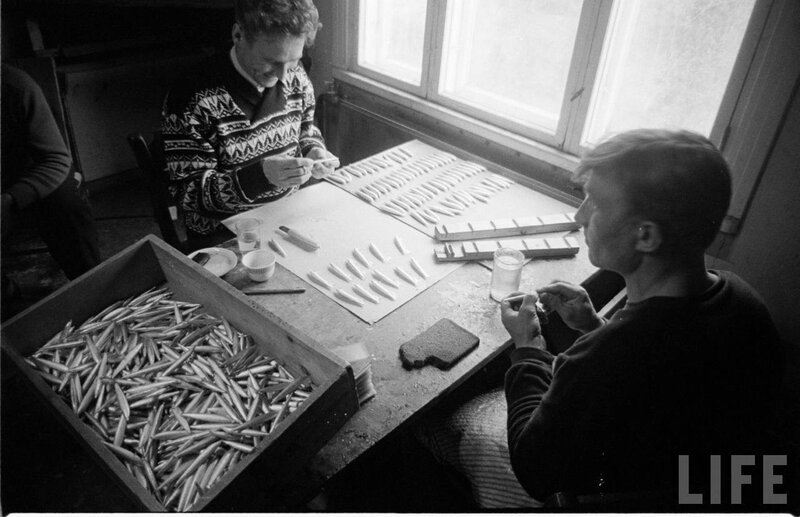 Men crafting wooden objects