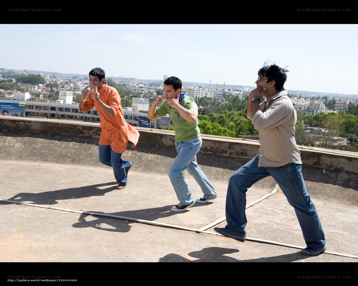 Men dancing on a rooftop