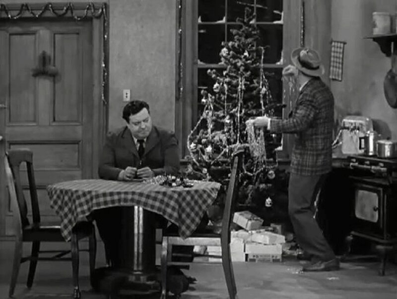 Men Decorating Christmas Tree