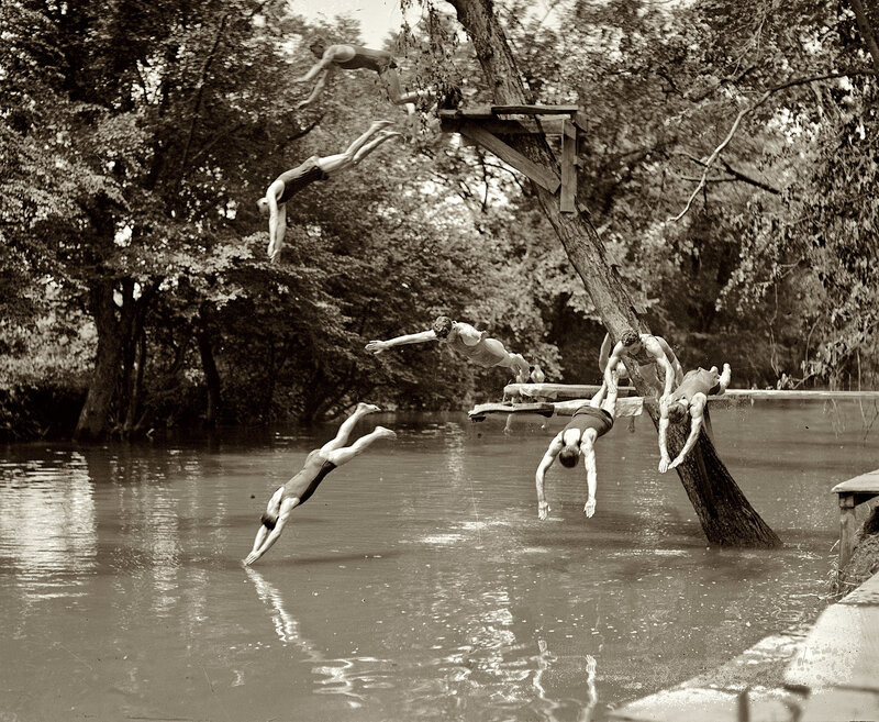 Men diving into a river