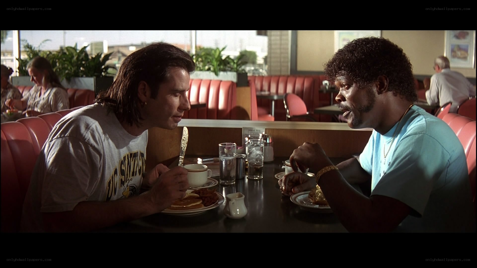 men eating breakfast in diner