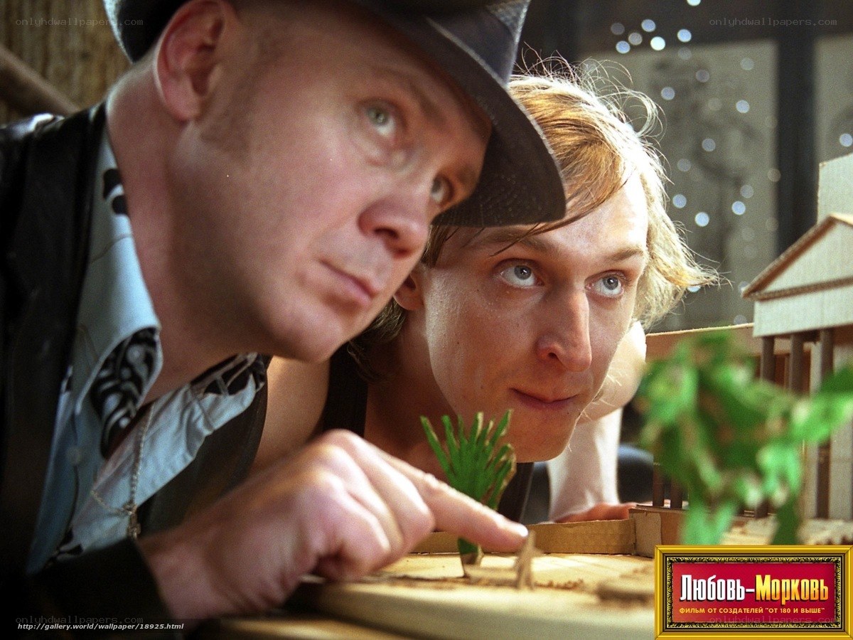 Men examining model architecture