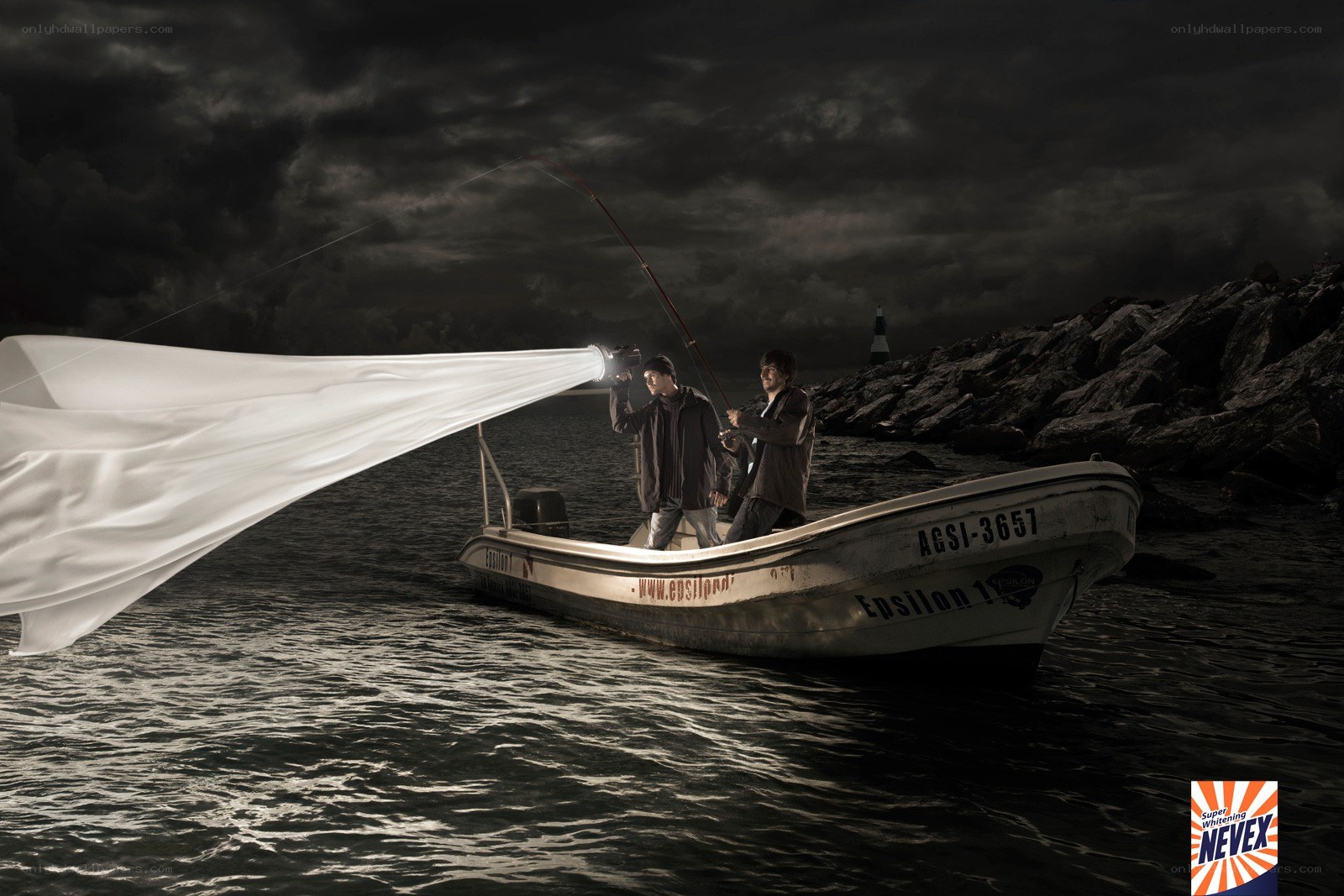Men fishing with light beam
