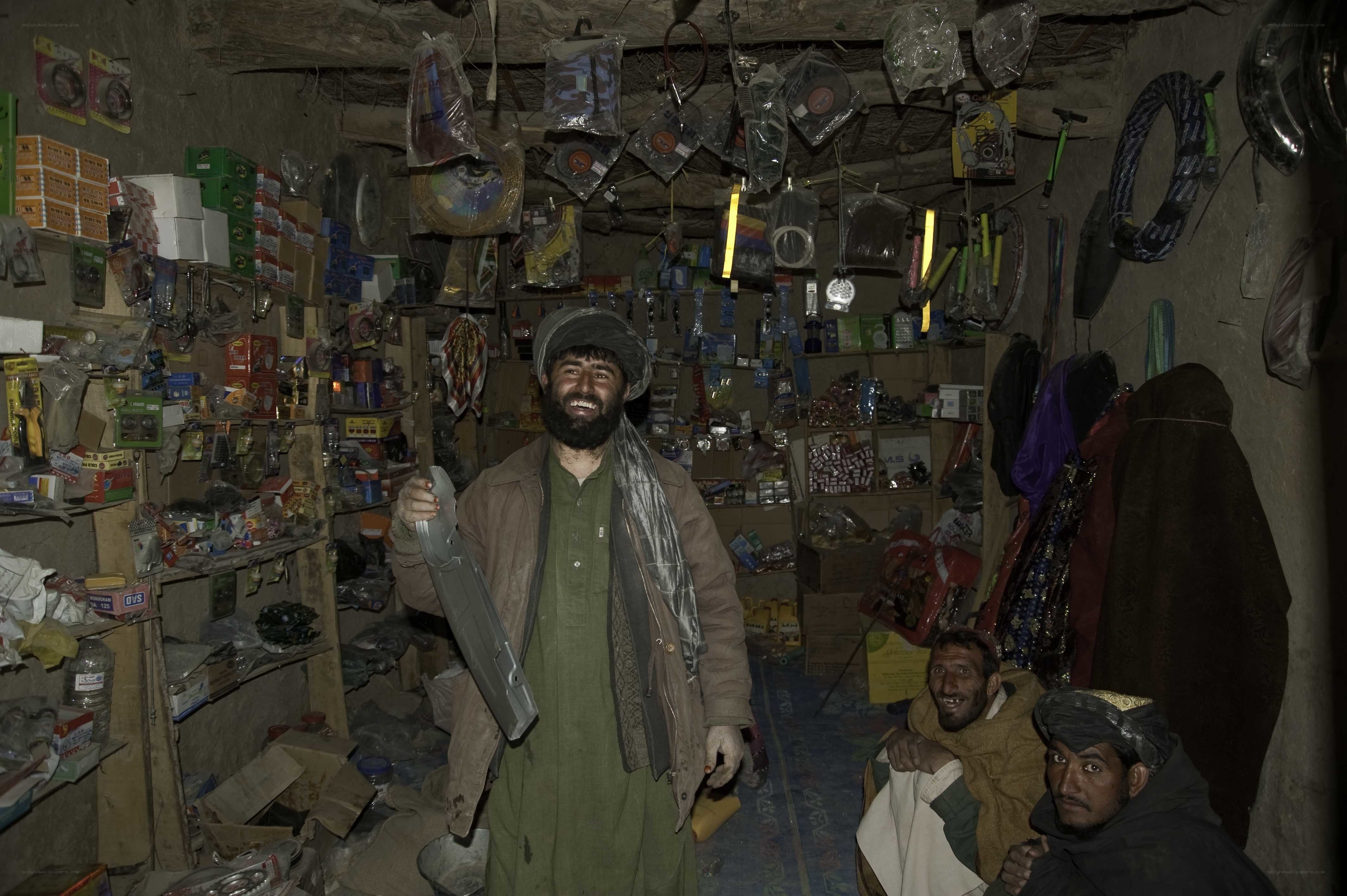 Men in a cluttered shop