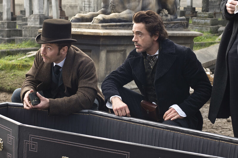 Men in a coffin at a cemetery