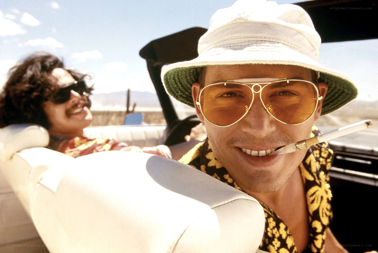 Men in a convertible car