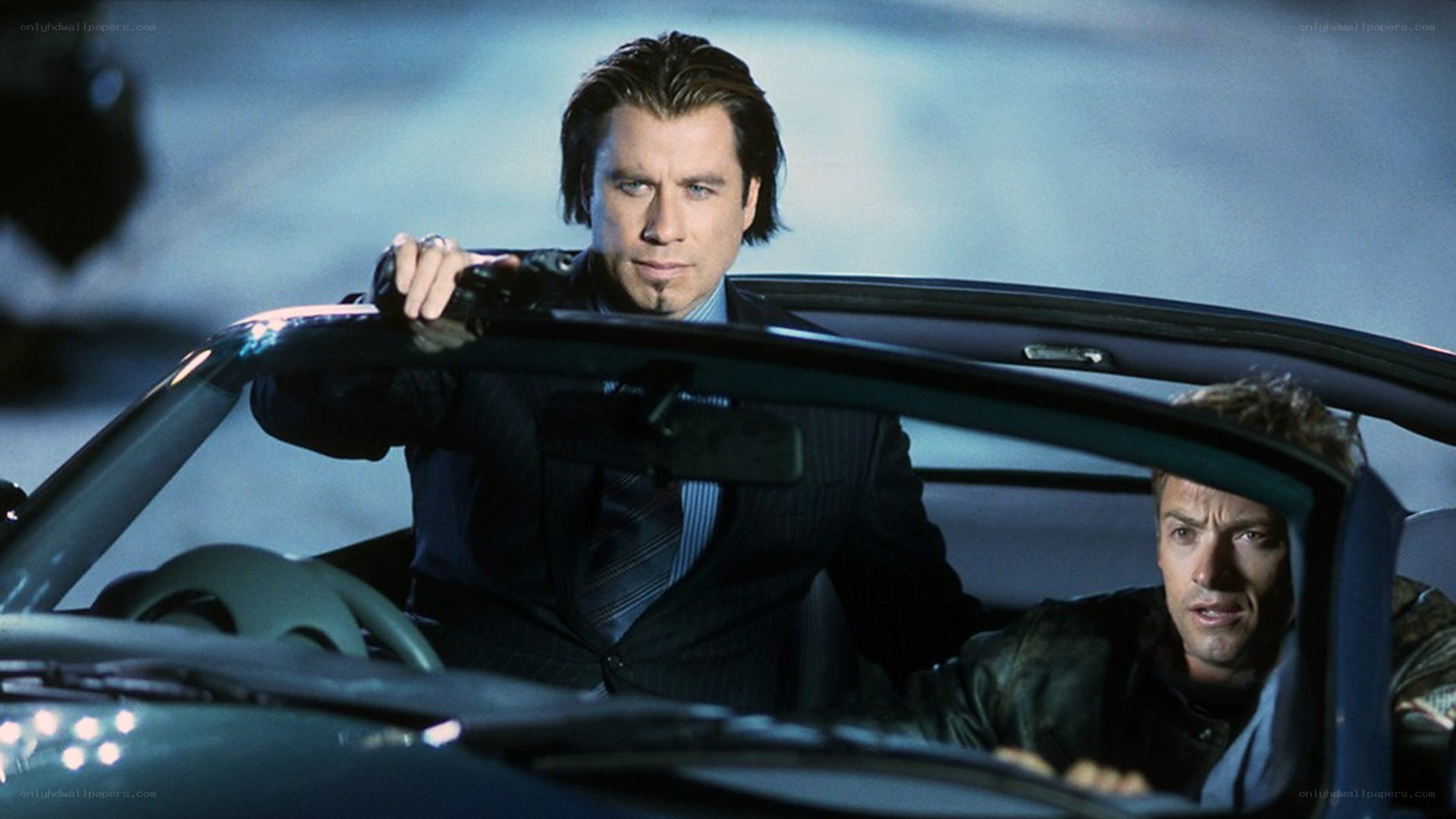 Men in a convertible car