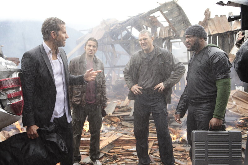Men in a destroyed area