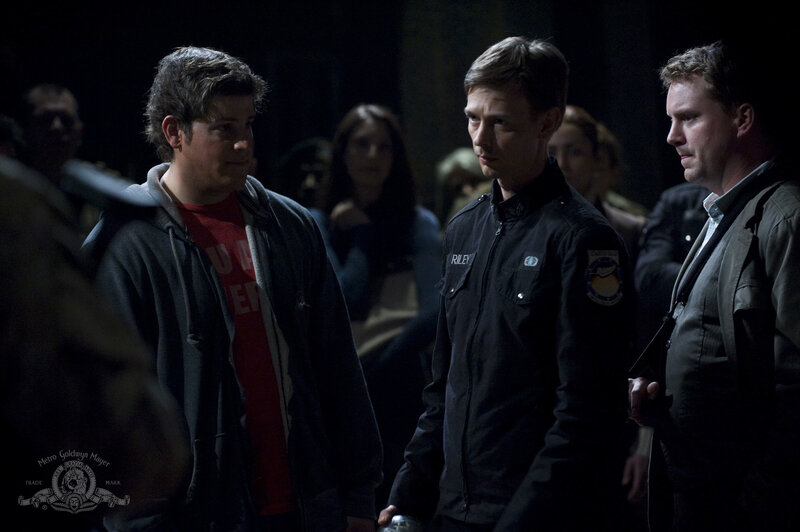 Men in a dimly lit room