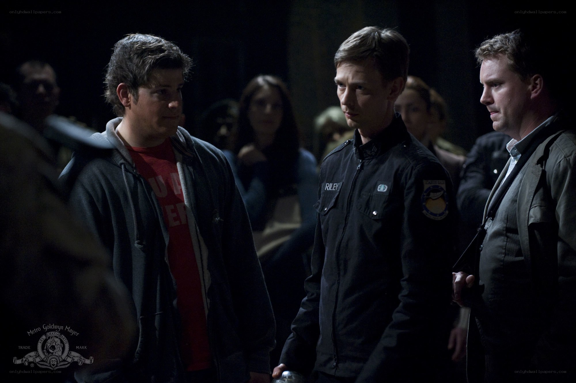 Men in a dimly lit room