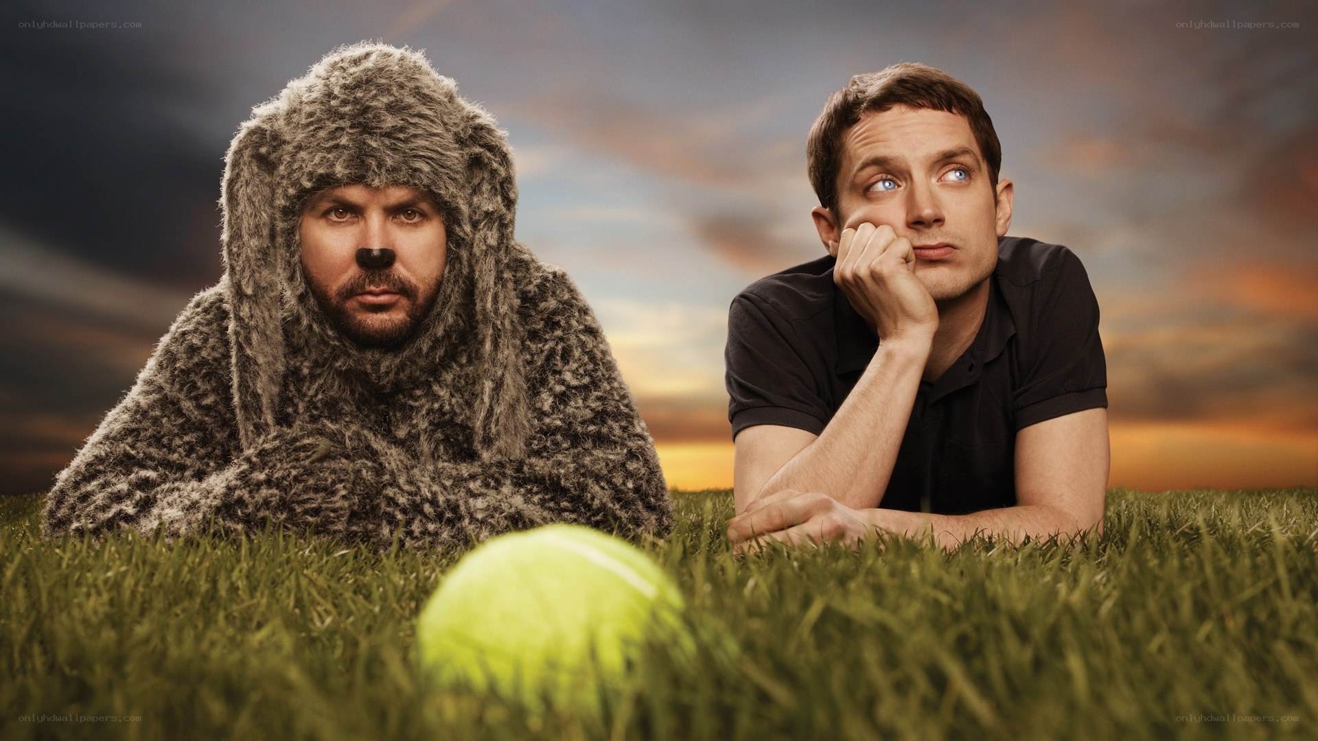 Men in a field with a tennis ball