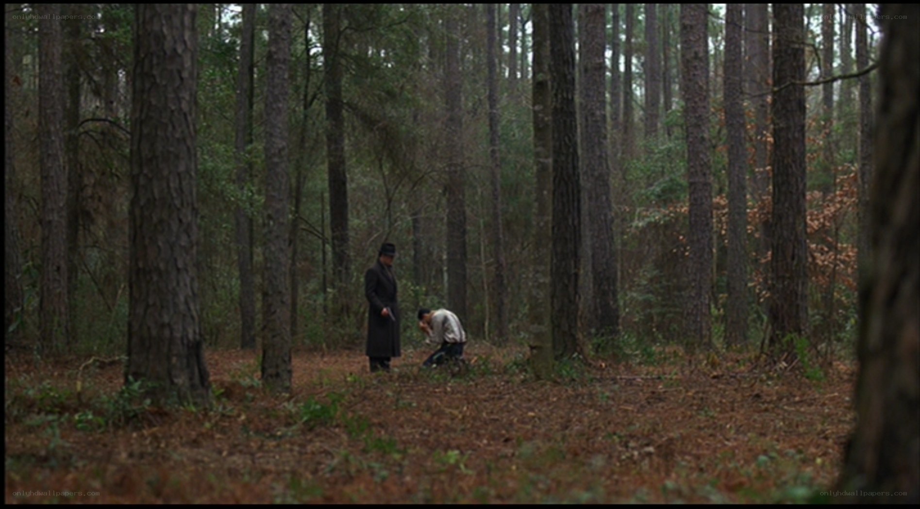 Men in a forest clearing