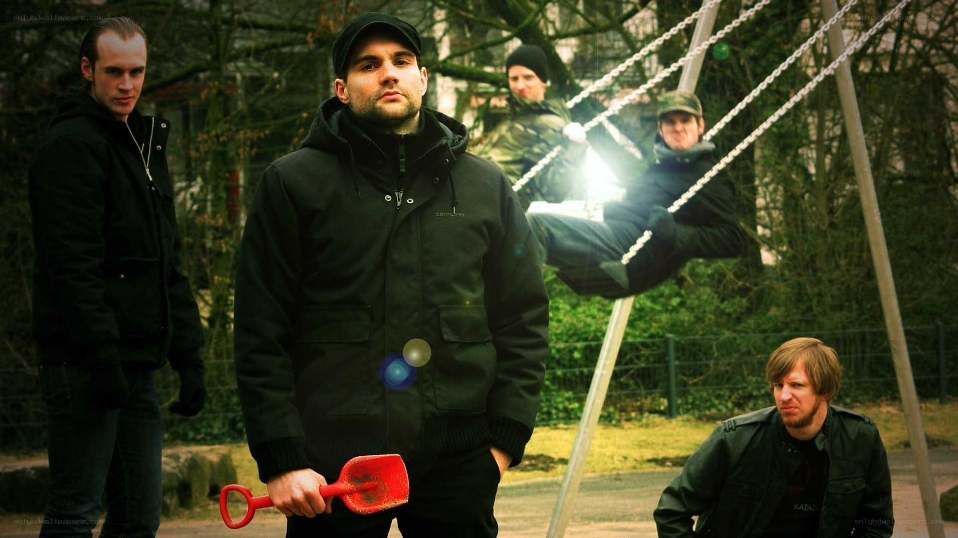 Men in a park with a shovel