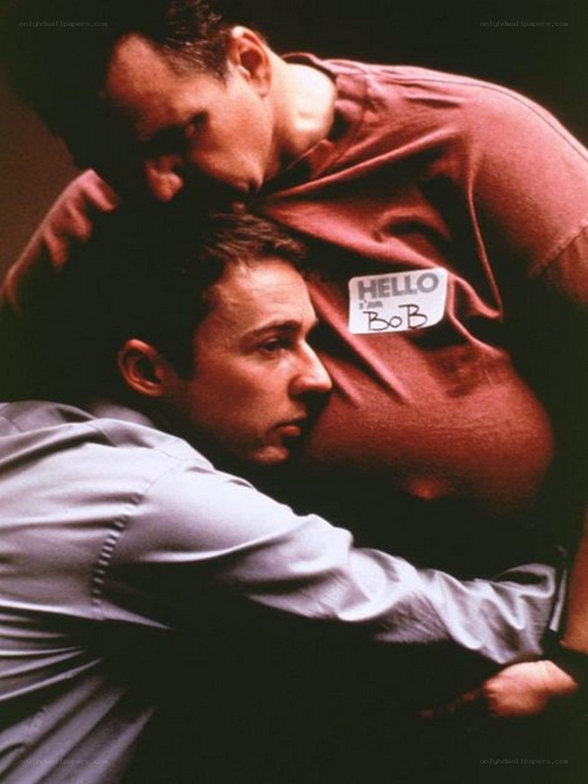Men in a tense embrace