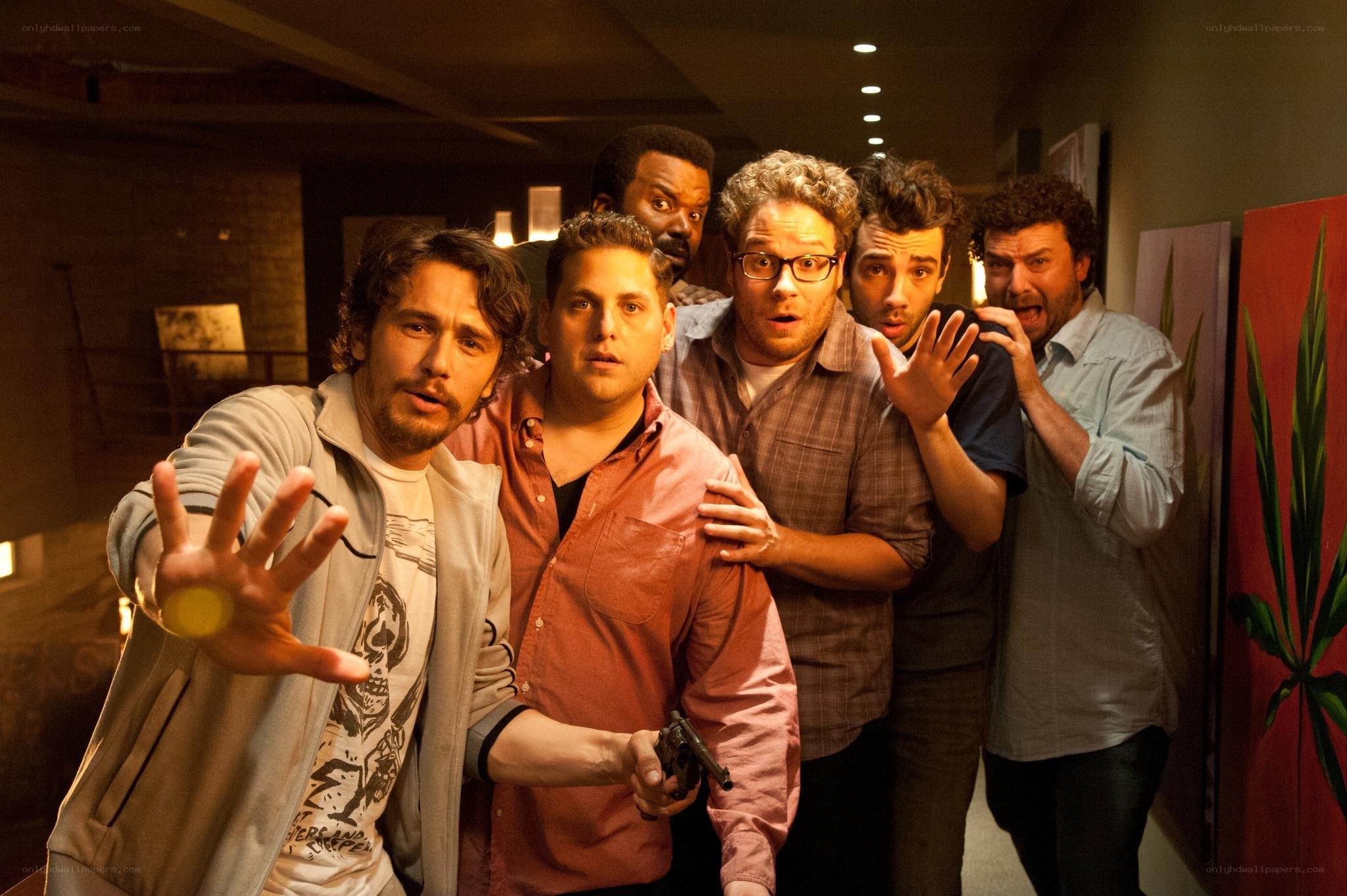Men in a tense hallway scene