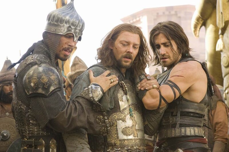 Men in Armor Supporting Man