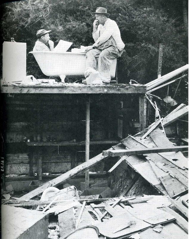 Men in bathtub on debris platform