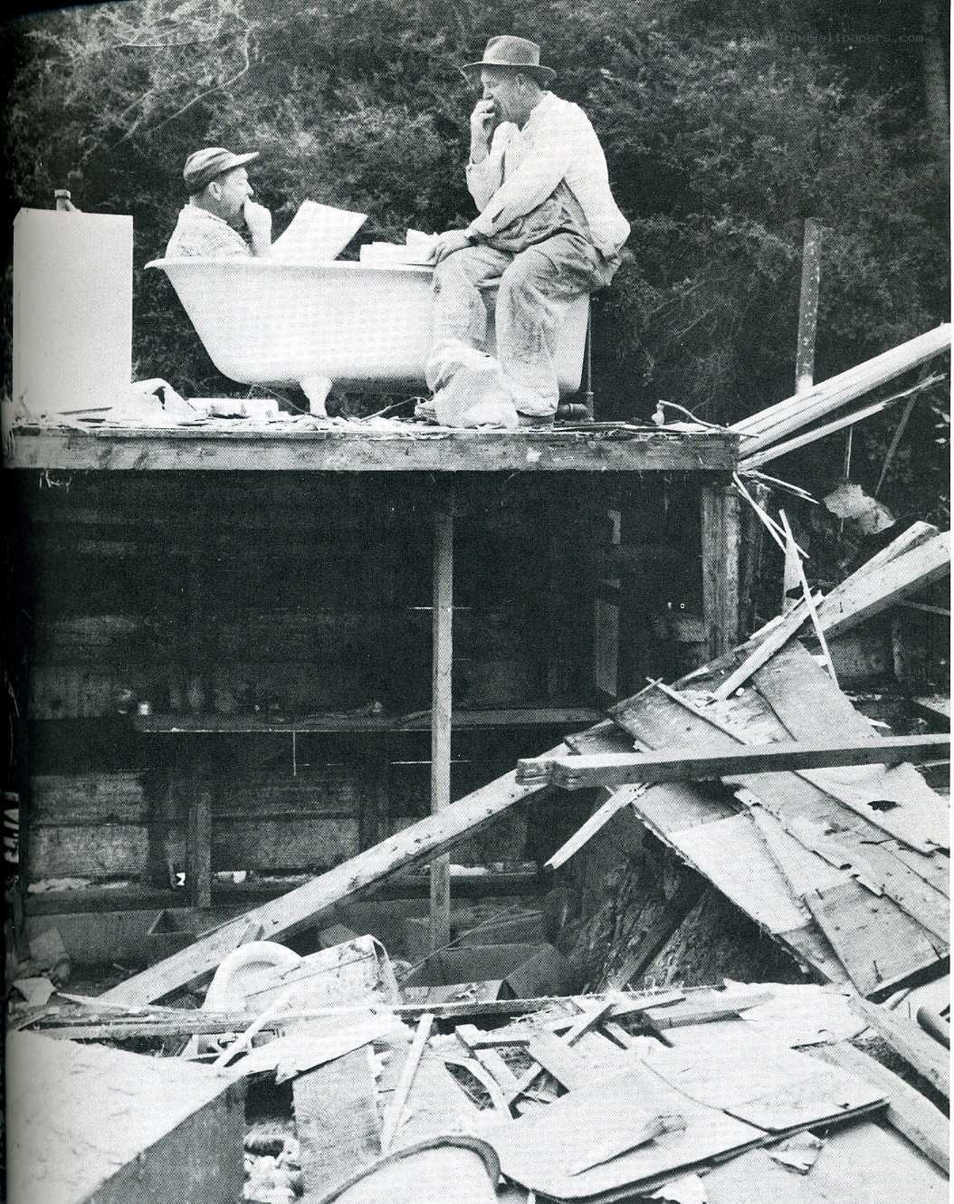 Men in bathtub on debris platform