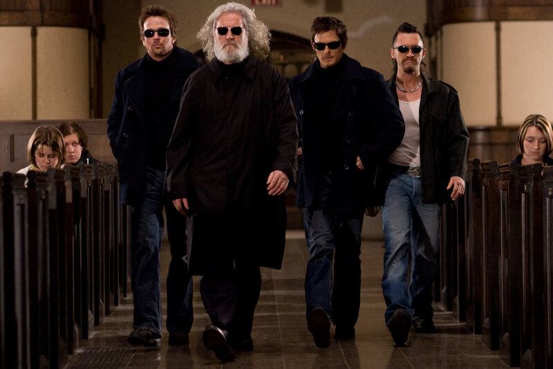 Men in black coats walking