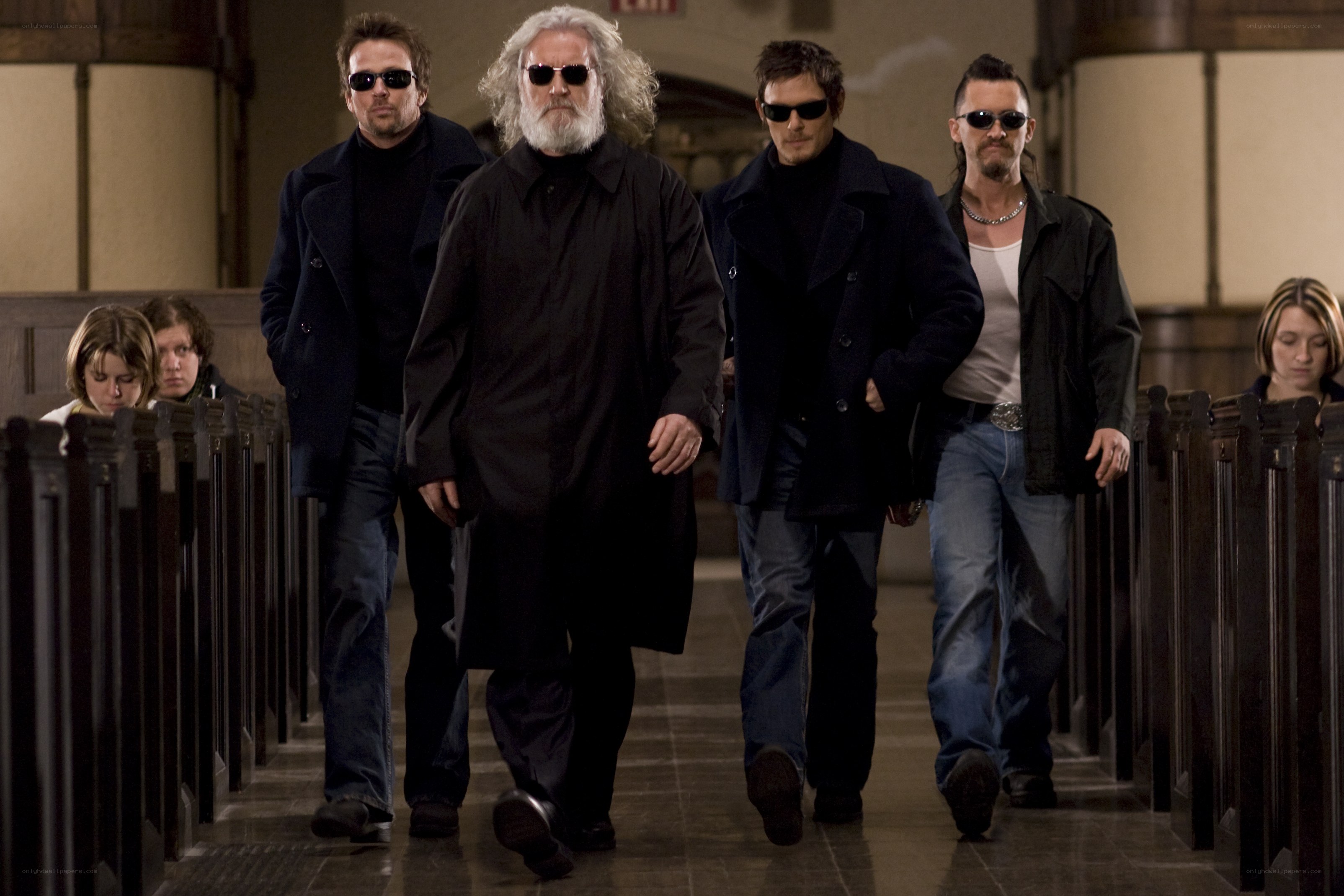 Men in black coats walking
