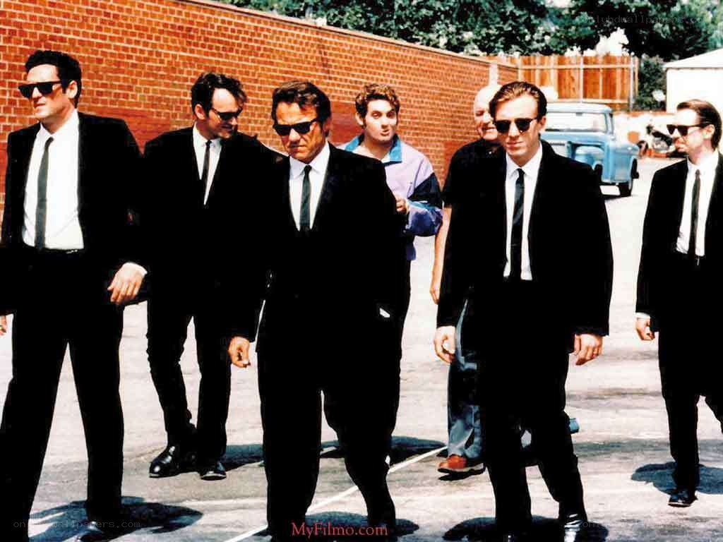 men in black suits walking