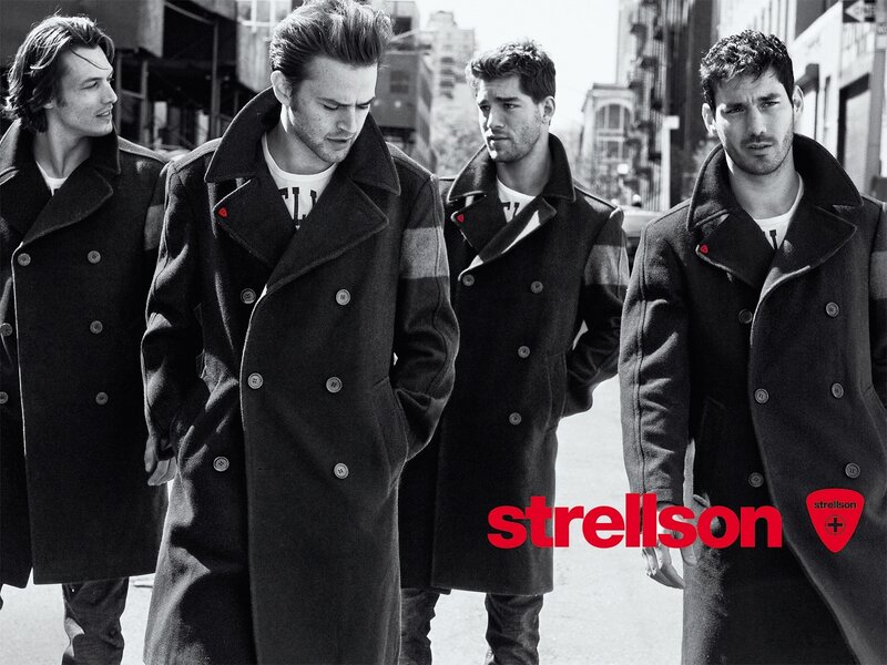 Men in coats on city street