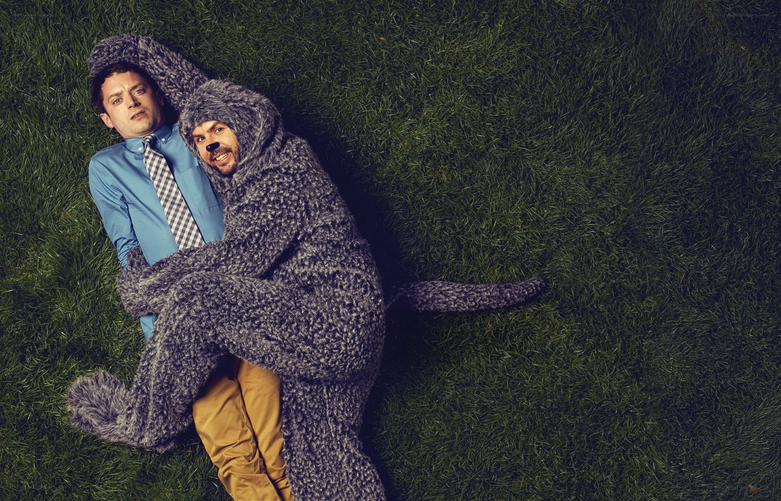 Men in costumes on grass