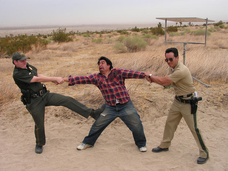 Men in Desert Struggle
