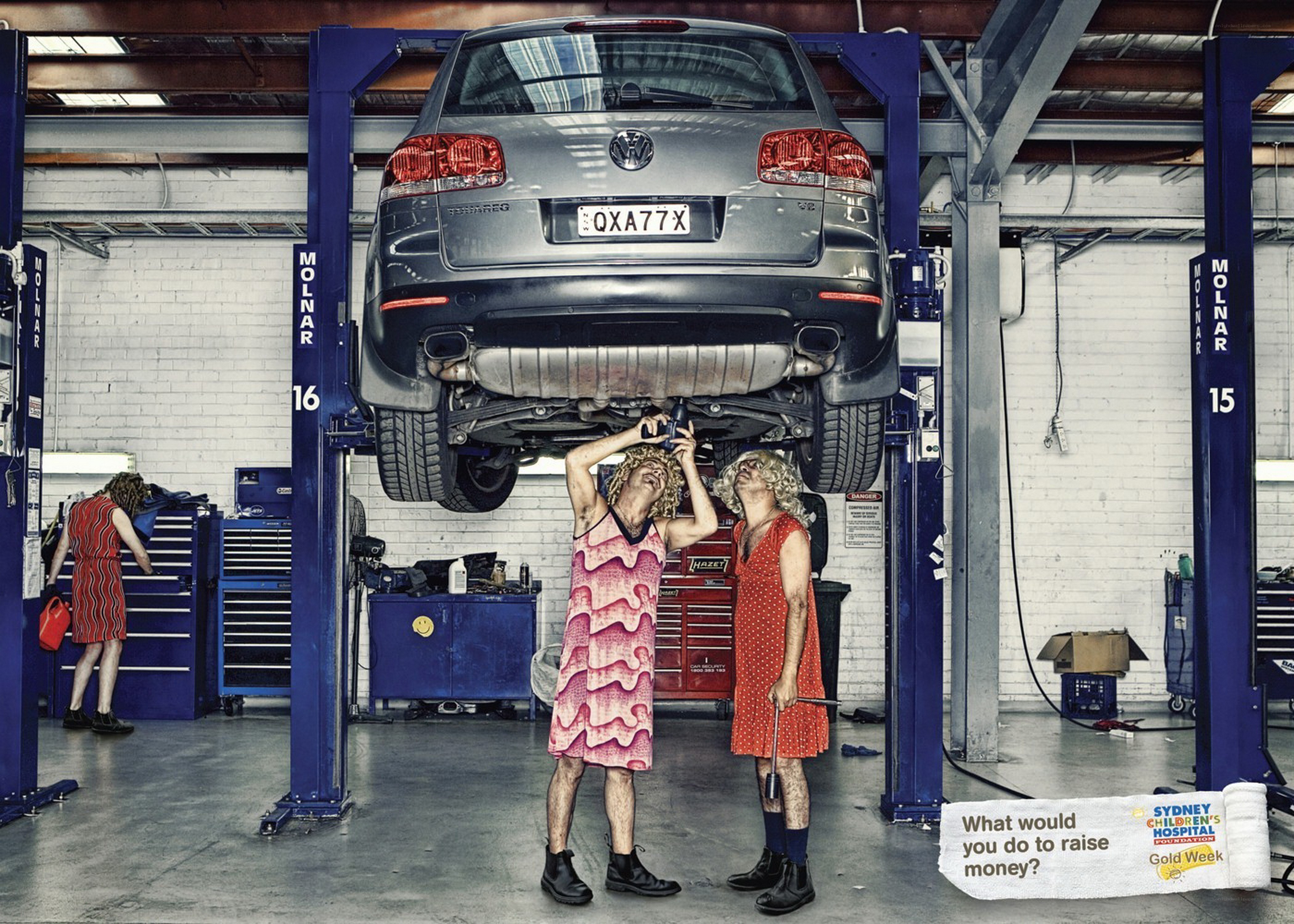 Men in dresses at auto shop
