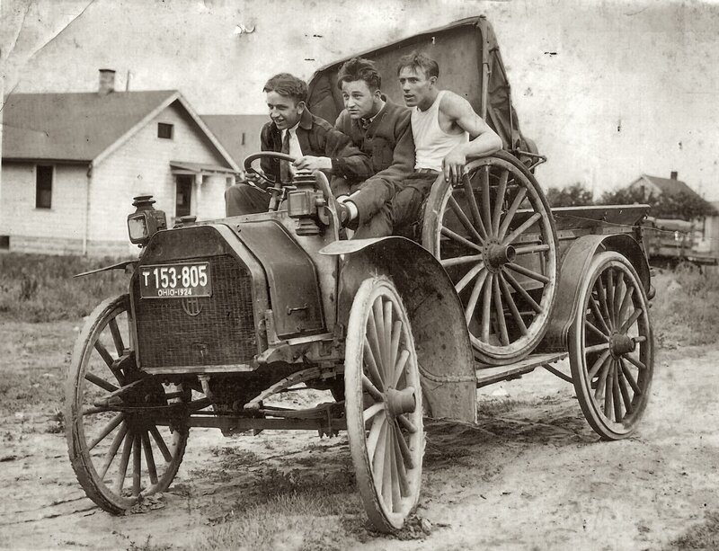 Men in early automobile