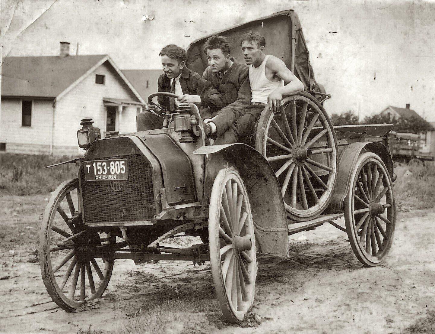 Men in early automobile