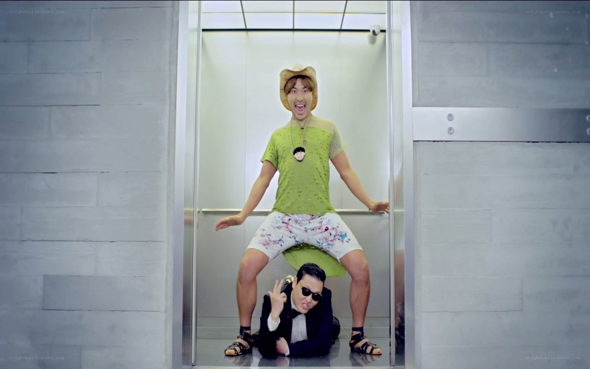 Men in elevator with props
