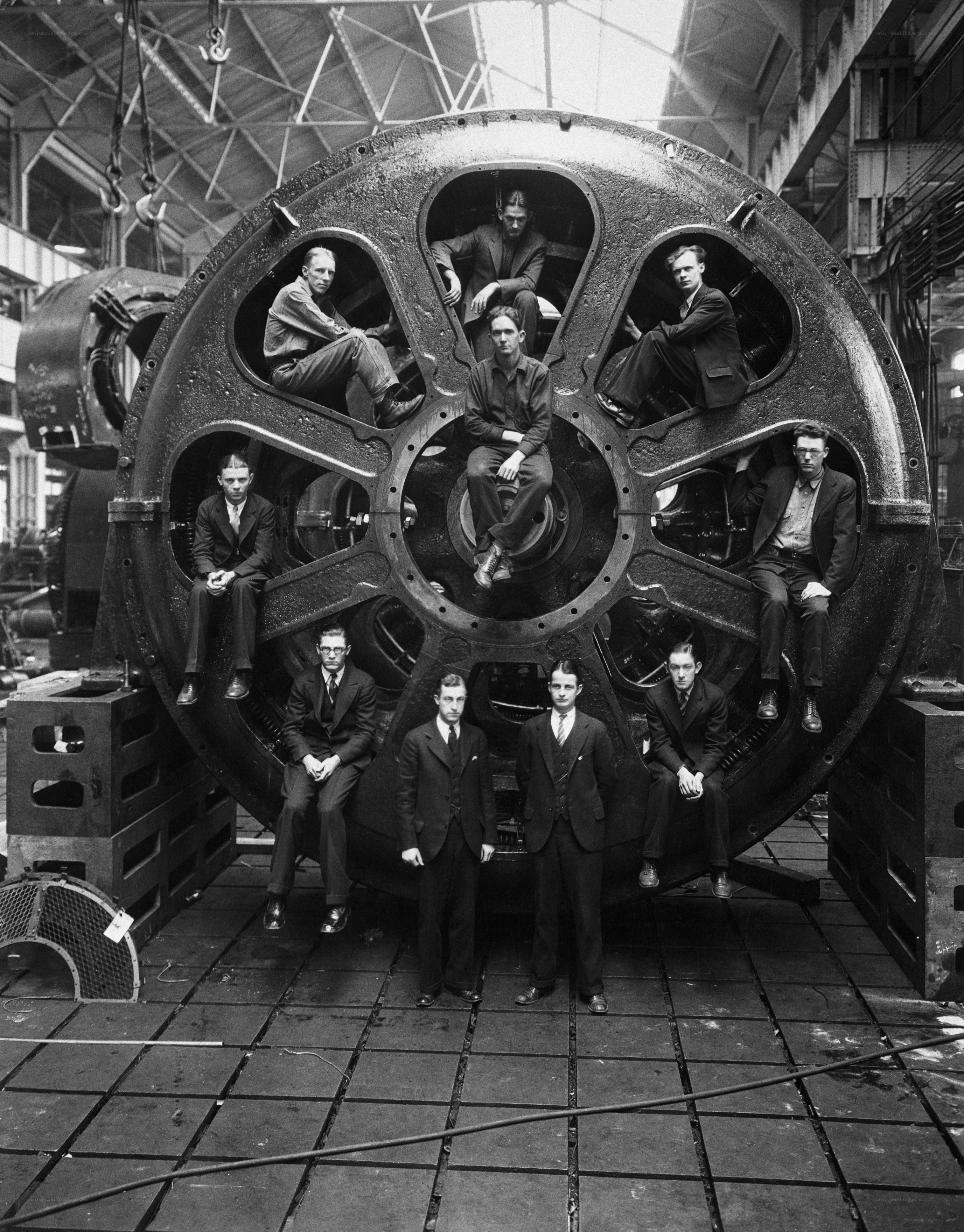 Men in factory with large machine
