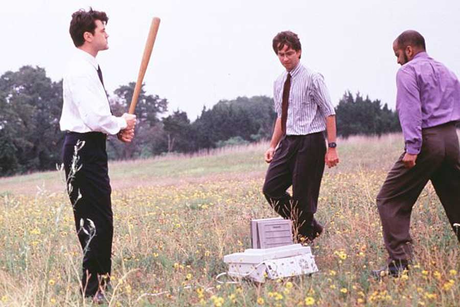 Men in field with baseball bat