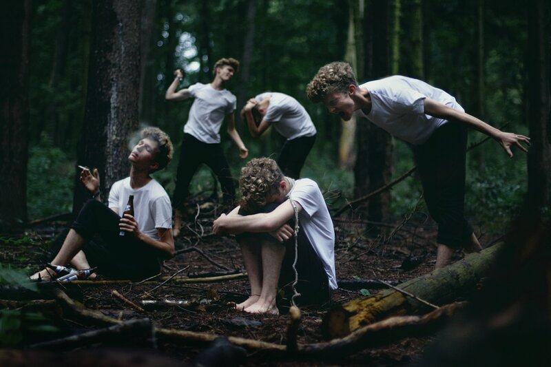 Men in forest with bottles