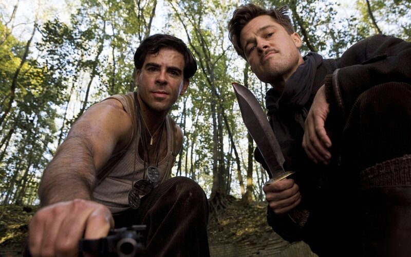Men in forest with knife and gun