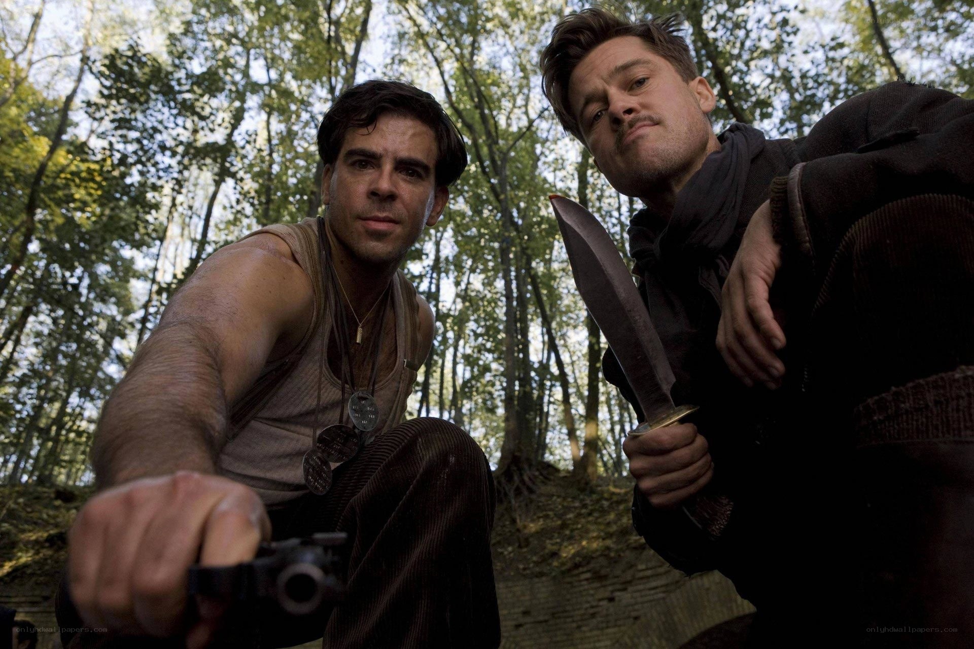 Men in forest with weapons