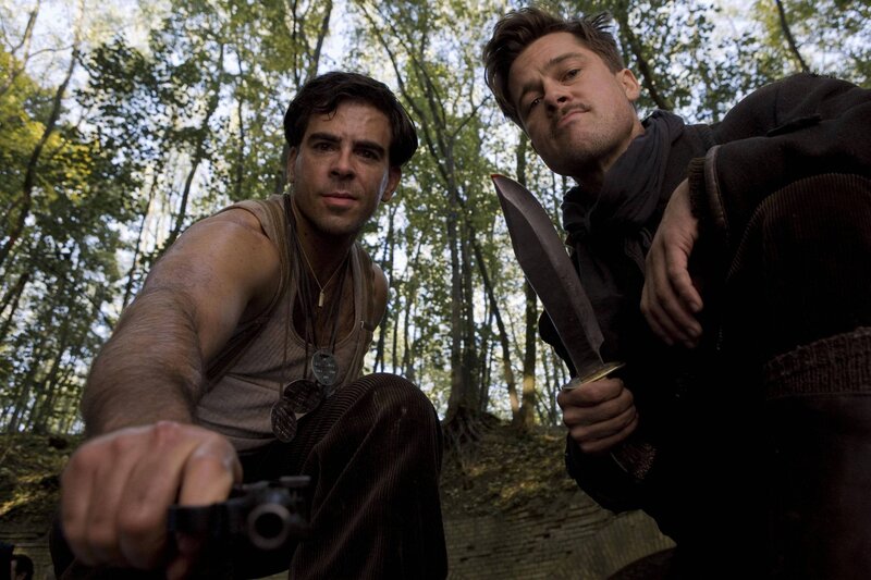 Men in forest with weapons