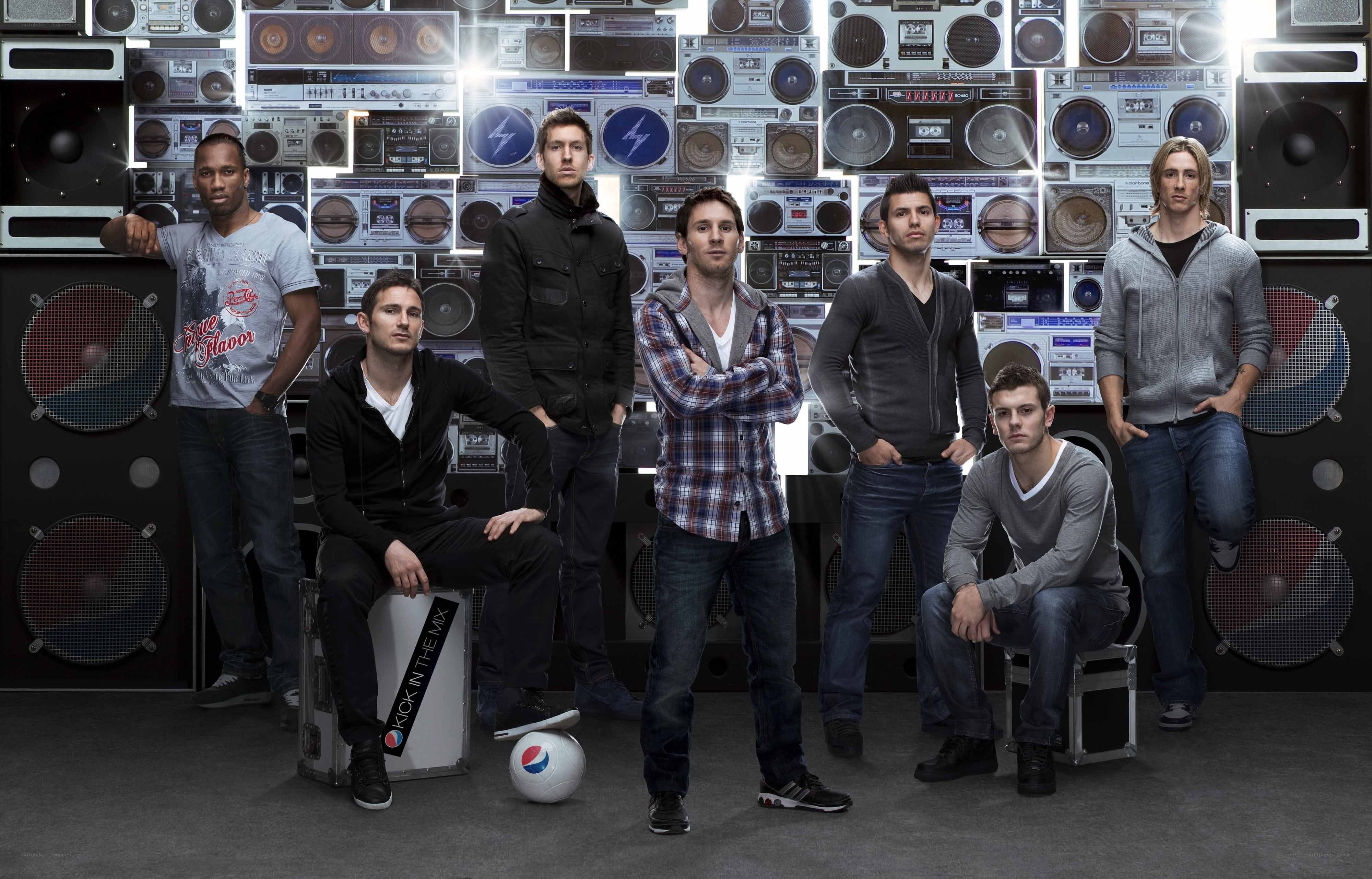 Men in front of boombox wall