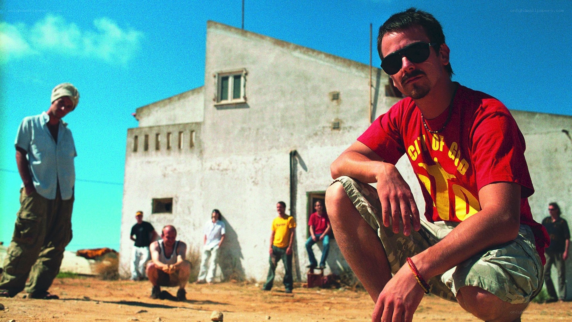 Men in front of white building