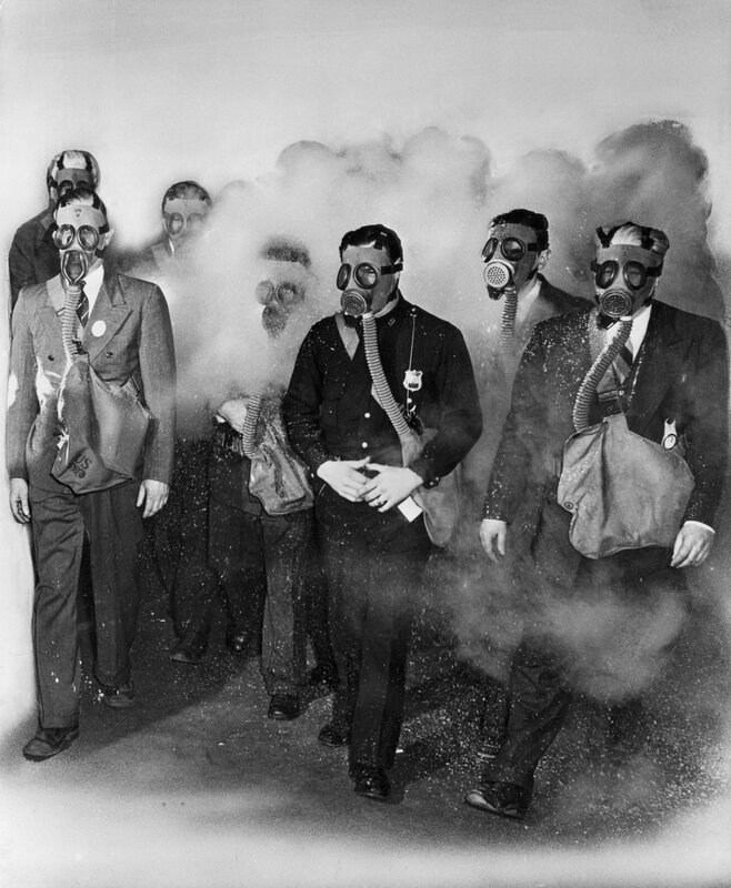 Men in gas masks during a demonstration
