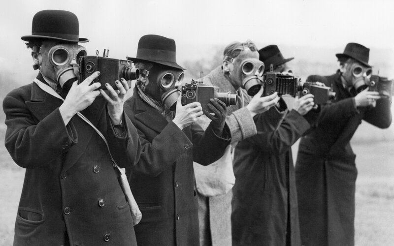 Men in Gas Masks with Cameras
