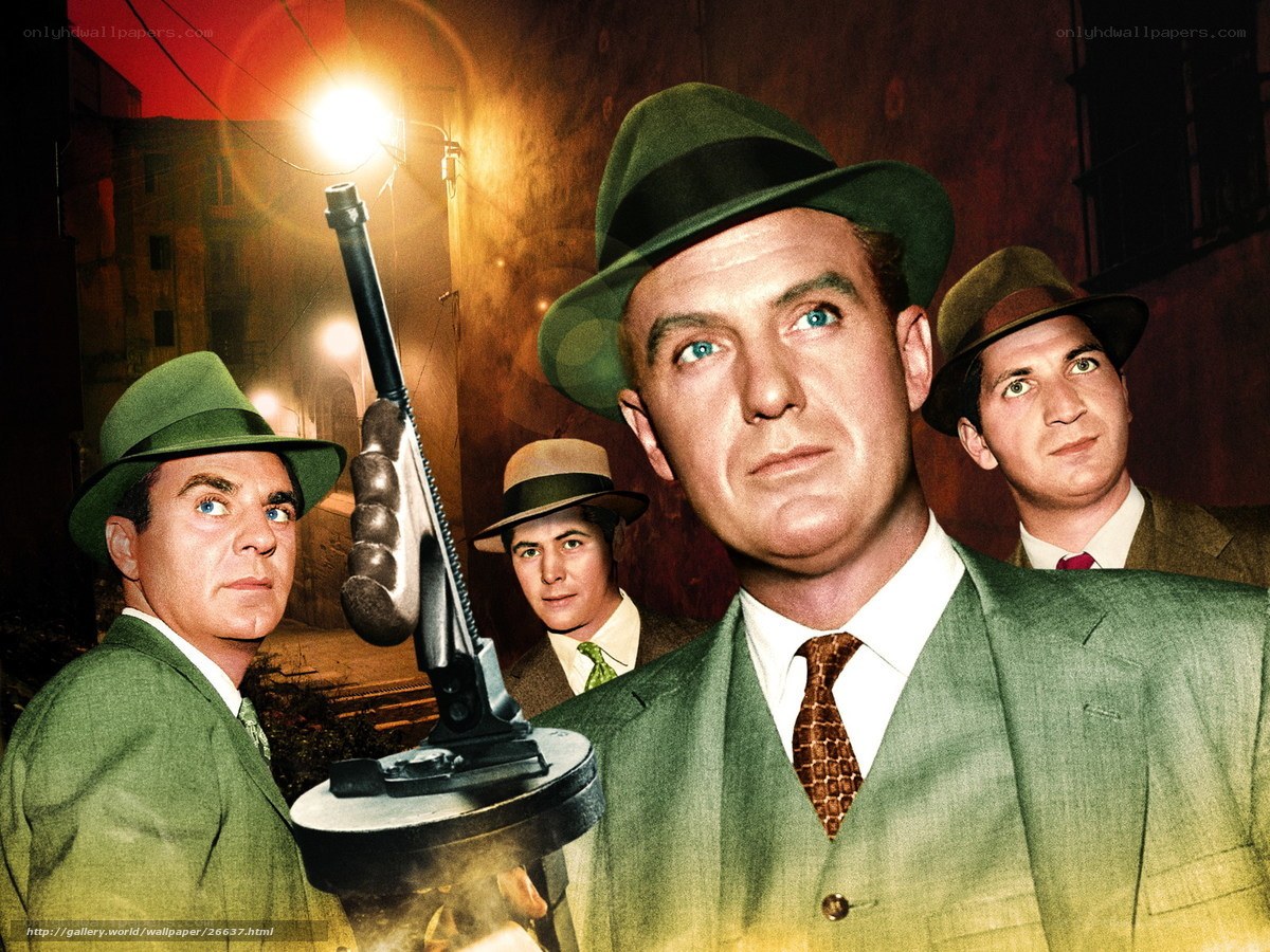 Men in green suits with a machine gun
