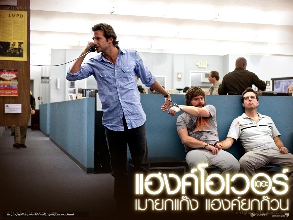 Men in handcuffs on phone