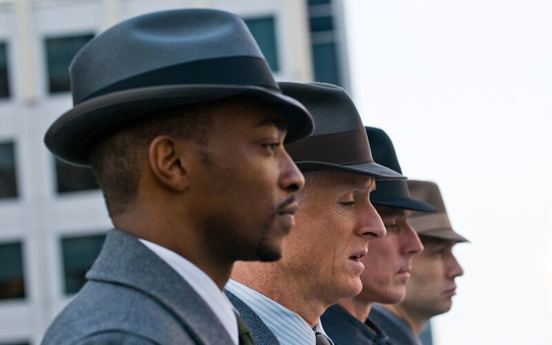 men in hats standing in line