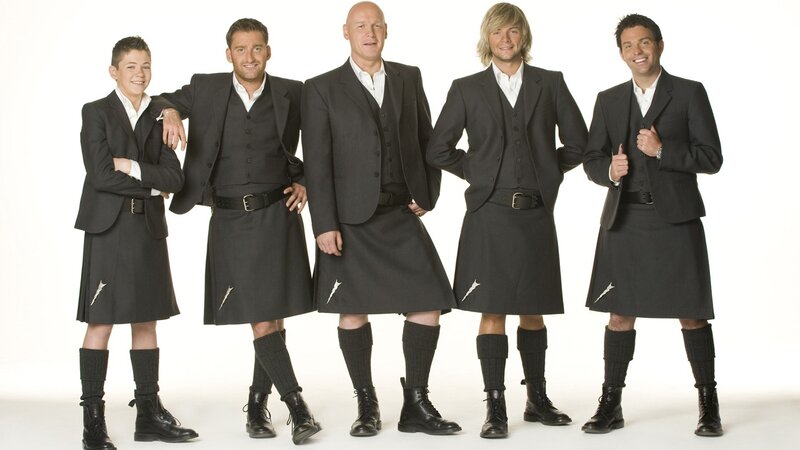 men in kilts posing