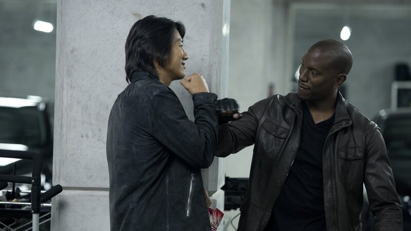 men in leather jackets interacting