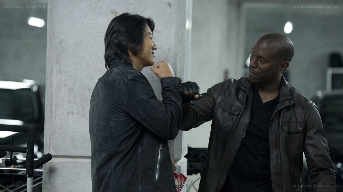men in leather jackets interacting