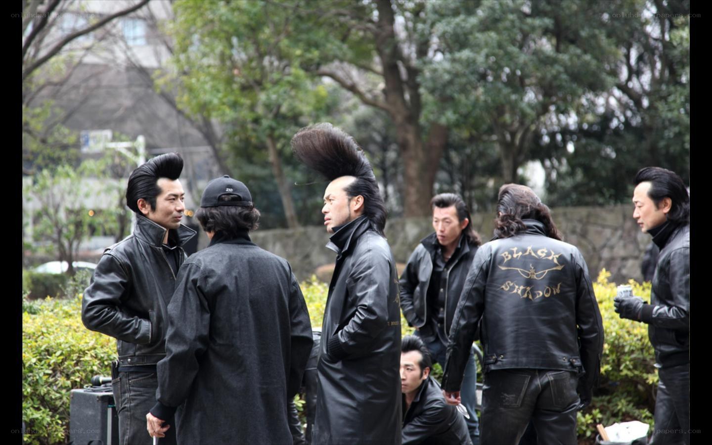 men in leather jackets with mohawks
