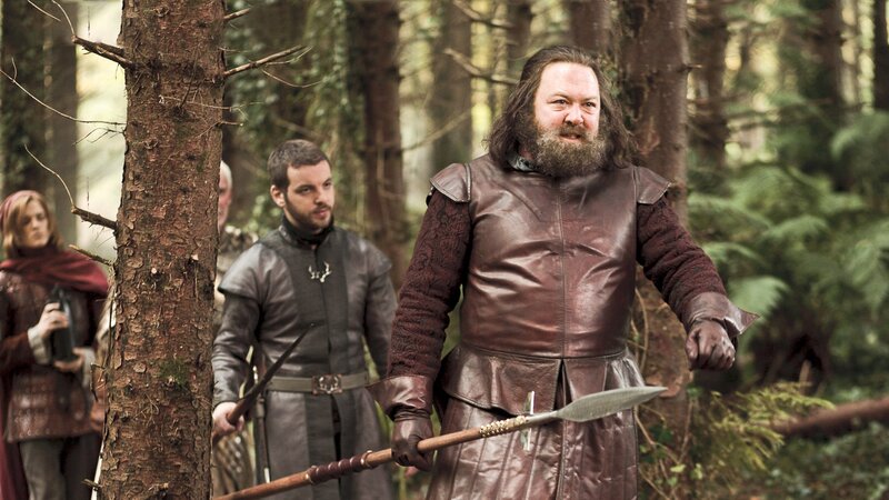 Men in medieval forest